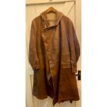Vintage tan leather driving or flying coat with button cross over collar, angled breast pocket and