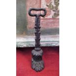 Edwardian cast iron door porter in the form of a lions paw with foliate cast handle, H34cm