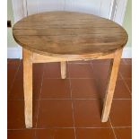 C19th pine cricket table, circular planked top on three faceted triangular out splayed supports,