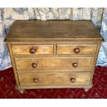 Victorian waxed pine chest with moulded top above two short and two long graduated drawers, turned