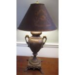 Regency style toleware decorated table lamp, urn shaped body with two scroll handles, on square base