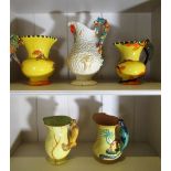 Clarice Cliff Harvest pattern jug, two Wadeheath jugs with Parrot handles, a similar Burleigh jug