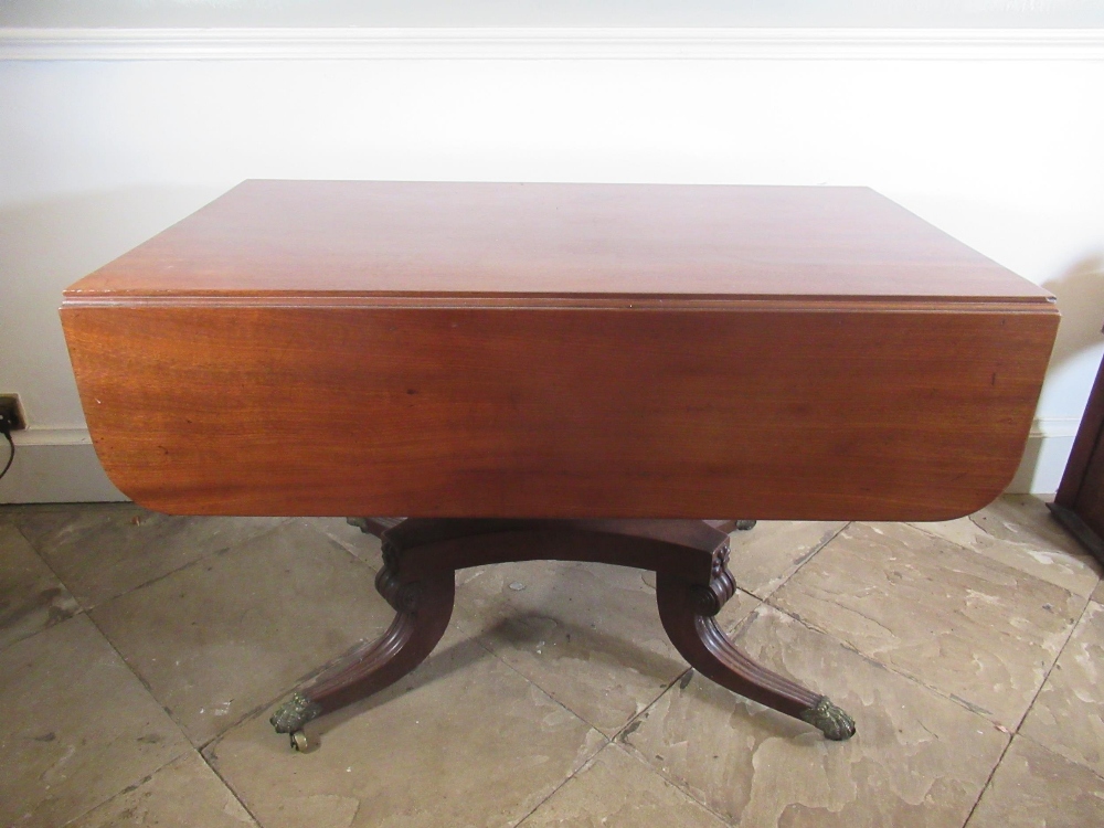 Regency mahogany pedestal Pembroke table, with end drawer and two fall leaves on angular baluster