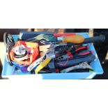 Collection of garden tools including hammer, secateurs, small anvil, sharpening stone, pliers,