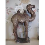 Tang style painted terracotta model of a standing camel, brown painted, H43cm