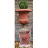 Large composite garden urn, part fluted body with moulded rim on lion mask and bead square moulded