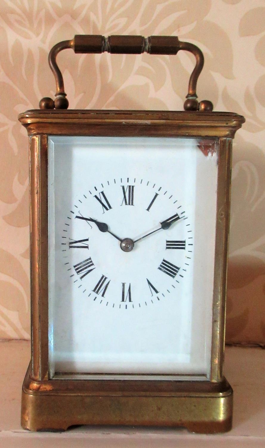 C20th French brass carriage clock, white enamel Roman dial in four bevel glass case, twin train