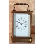 C20th French brass carriage clock, white enamel Roman dial in four bevel glass case, twin train