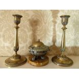 Pair of C19th French brass candlesticks with anthemion detail, urn sconces on tapering column on