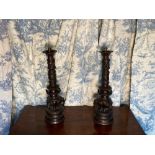 Pair of Indian bronze table lamps, the pierced columns cast with dragons on triple elephant