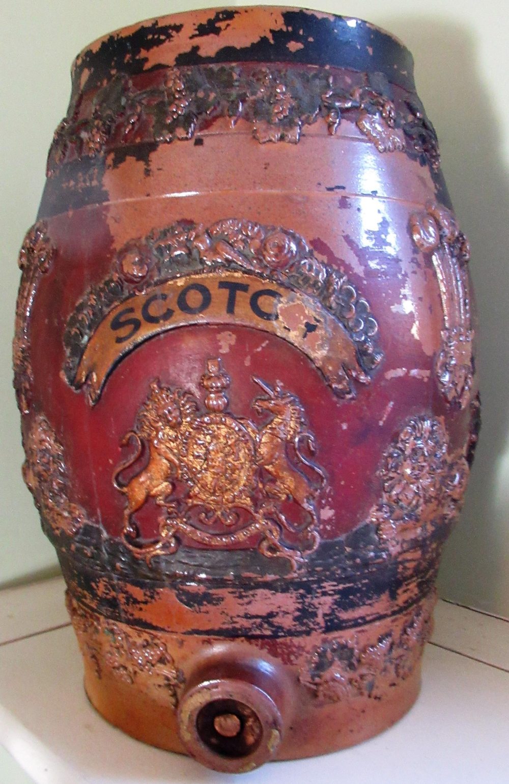 Victorian salt glazed stoneware spirit barrel, relief decorated with a hop bands, Royal crest,