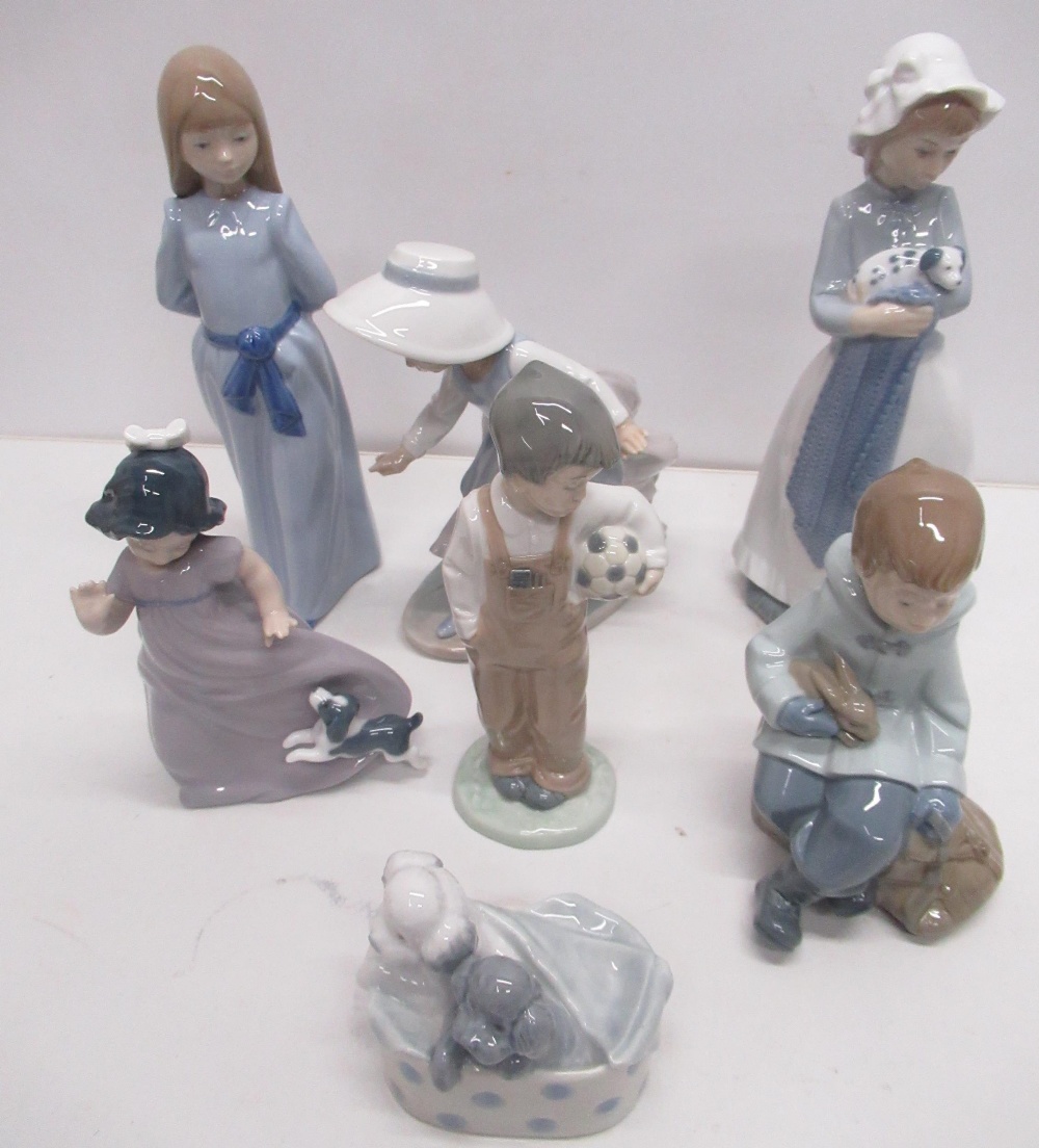 Collection of Nao figures, mostly children including girl with puppy, boy with football, boy with - Image 3 of 8