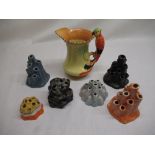 W & R Carlton Ware orange lustre flower vase/spill holder, five other flower vases/spill holders,