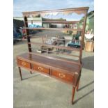 Early C19th dresser with three tier raised back above three drawers with carved detail and pad