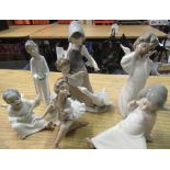 Lladro figurines of two angels, young boy angel playing musical instrument, ballerina, young girl