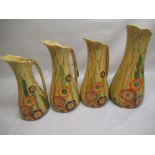 Carlton Ware Australian Design set of three graduated jugs, moulded floral and painted decoration