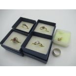 Collection of 9ct gold rings set with white stones, garnets and sapphires, a hallmarked Sterling