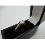 Hallmarked 9ct yellow gold solitaire ring with a round cut diamond inset in a decorative square