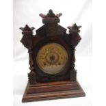 Ansonia Clock Co. New York USA, late C19th/early C20th oak cased mantel clock, carved case on shaped