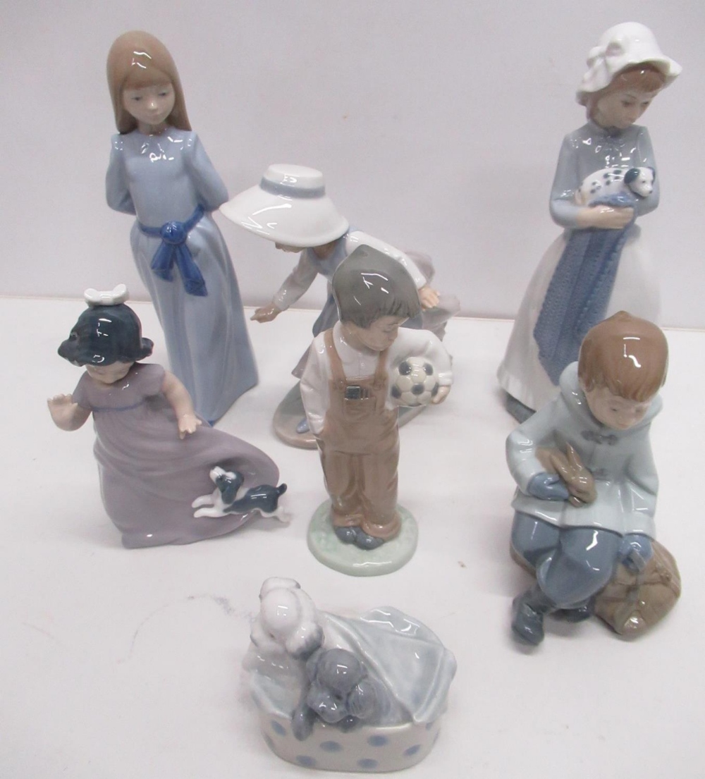 Collection of Nao figures, mostly children including girl with puppy, boy with football, boy with - Image 4 of 8