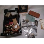 A selection of various items including a barometer, draughtmans set, Indian brassware and some WW2