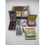 Collection of smoking accessories including lighters, cigarette cases, cigars, Willem II Optimum and