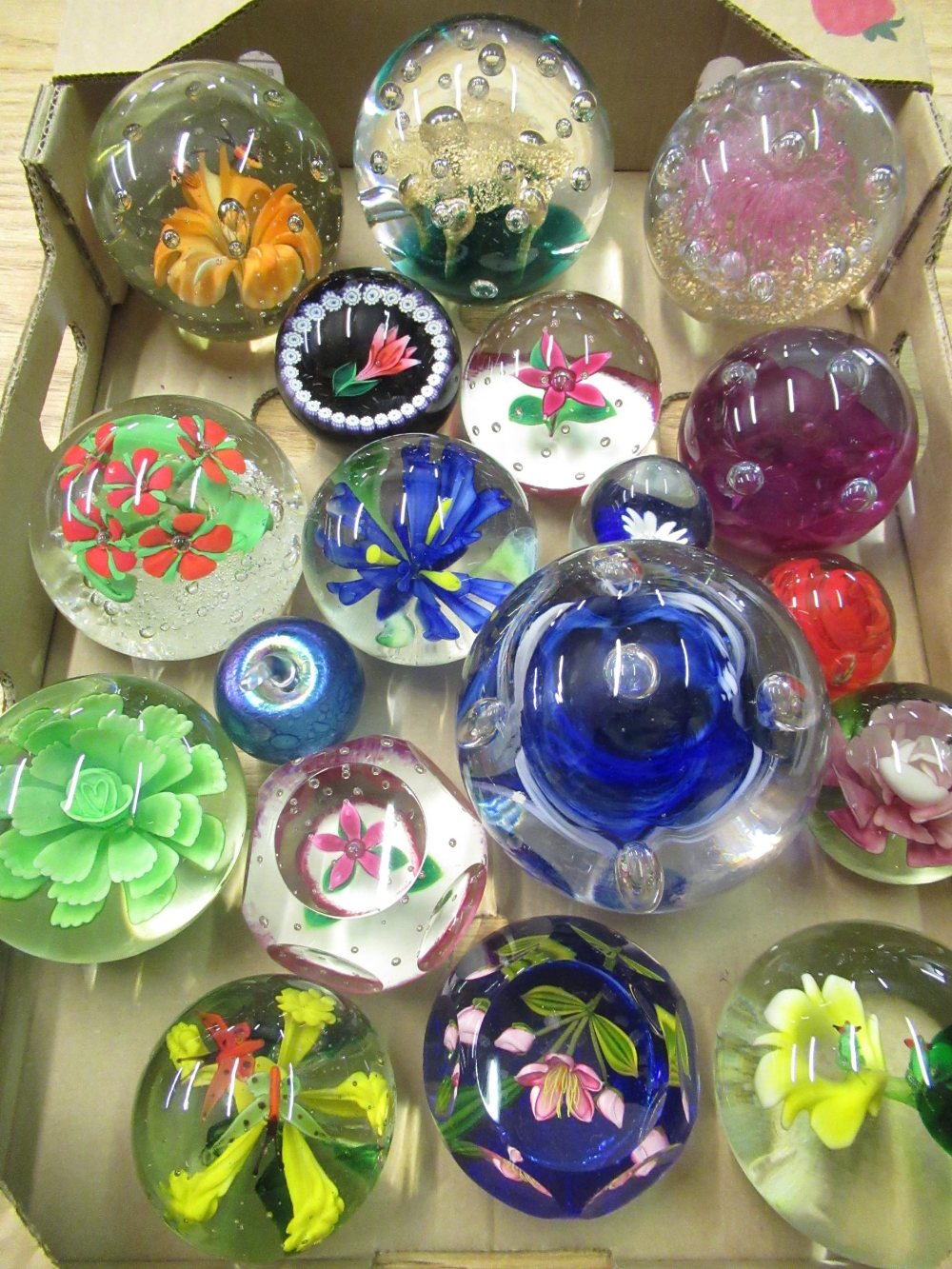 Collection of various sized paperweights, including Selkirk glass, Caithness Moonflower, etc