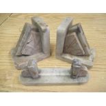 Pair of Art Deco white variegated marble bookends of geometric form and a similar photograph