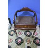 Edwardian mahogany inlaid piano style stool with low arms and lift up seat