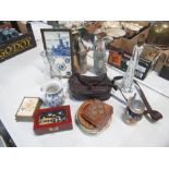 Collection of assorted items including a leather bag, framed tile with "International Police