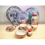 Collection of oriental hand painted teacups, saucers, vases, and plates including Chinese pattern