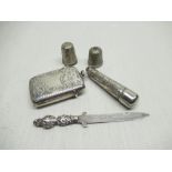 An engraved silver vesta case hallmarked Birm 1902, together with a silver cheroot holder, two