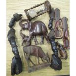 Selection of wooden items including carved African heads, elephants, hippopotamus, oak egg timer,