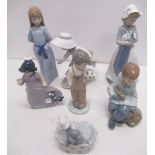 Collection of Nao figures, mostly children including girl with puppy, boy with football, boy with