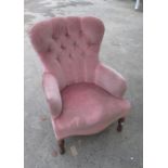 Victorian style deep buttoned back upholstered nursing style arm chair on turned supports