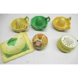 Carlton Ware yellow buttercup cheese dish and cover, three Carlton Ware juicers, Carlton Ware