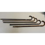 Set of five walking canes with silver collars dating from Birmingham 1914, ebony, bamboo, blackthorn