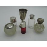 Collection of dressing table jars with hallmarked Sterling silver collars a match striker with