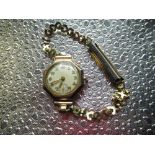 Mid C20th ladies cocktail watch in 9ct gold case and yellow metal strap