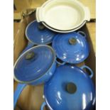 Two Le Creuset blue enamel cast iron lidded casserole pans, two matching sauce pans, two matching