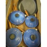 Four Le Creuset blue enamelled cast iron sauce pans and matching frying pan (5)