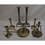 Two silver-plate candlesticks, two brass candlesticks, brass candle holder and two other brass