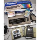 Commodore 64 micro computer, with three boxes of C64 tape cassette games and accessories