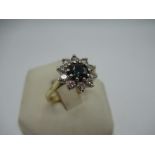 18ct yellow gold cluster ring with central tourmaline surrounded by ten round cut diamonds, mount