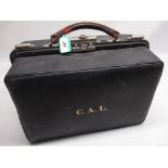 Early C20th black leather Gladstone type vanity case with green watermarked lift out silk