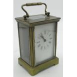 Early C20th brass carriage clock timepiece with cylinder movement, enamel face with Roman