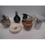 Eighteen branded ceramic whisky advertising water jugs and a ashtray, Tullamore Dew, Bowmore,