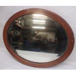 Oval framed mirror