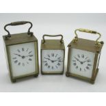 Early C20th French travel clock with white enamel dial and hinged handle, movement stamped France,