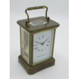 Matthew Norman, Swiss, retailed by Mappin & Webb Ltd C20th brass cased carriage clock timepiece with